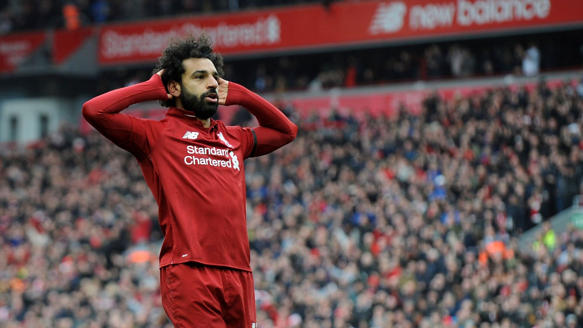 Mohamed Salah celebrates after scoring his side’s second goal during the English Premier League football match between Liverpool and Chelsea at Anfield stadium.