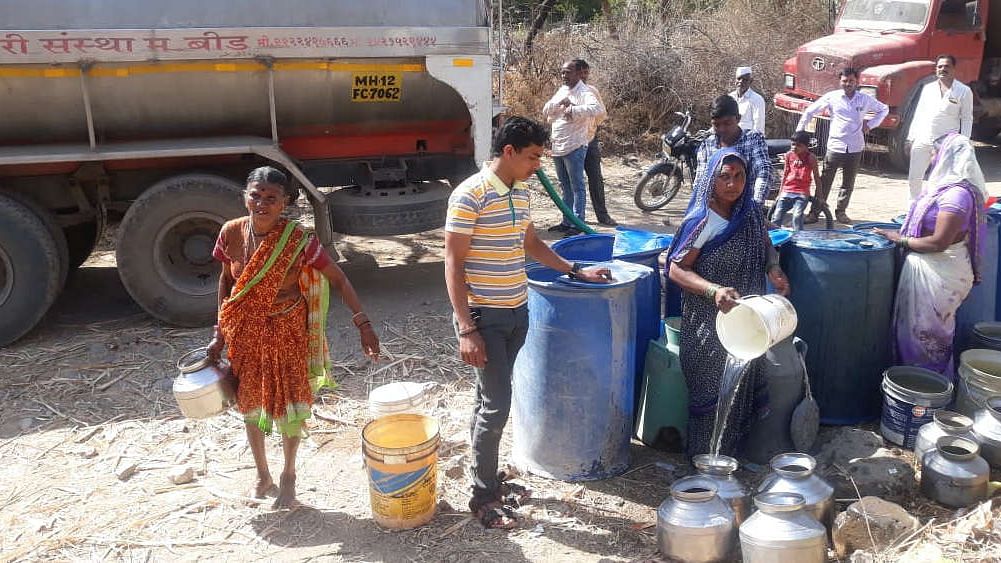 Villagers in Dahiwandi, a village in Maharashtra’s drought-prone Beed district, fill up their vessels with water supplied by a government tanker. By February this year, three months before the onset of summer, Dahiwandi was already hit by acute water shortage.