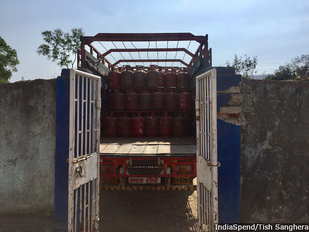 A Hindustan Petroleum truck filled with LPG cylinders prepares to leave a depot outside Manor, a village in Thane district, Maharashtra.