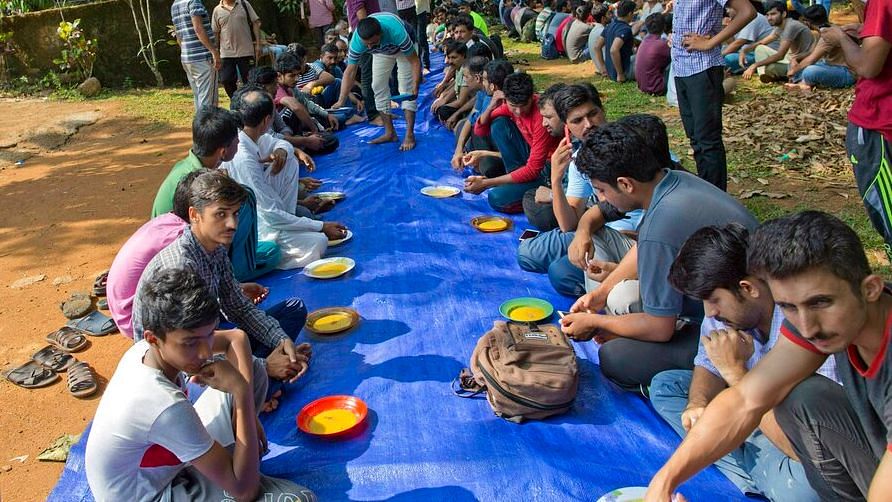 Ahmadi Muslim refugees wait to eat a meal at a community center that they took refuge in Pasyala, north east of Colombo, Sri Lanka on 25 April 2019. &nbsp;