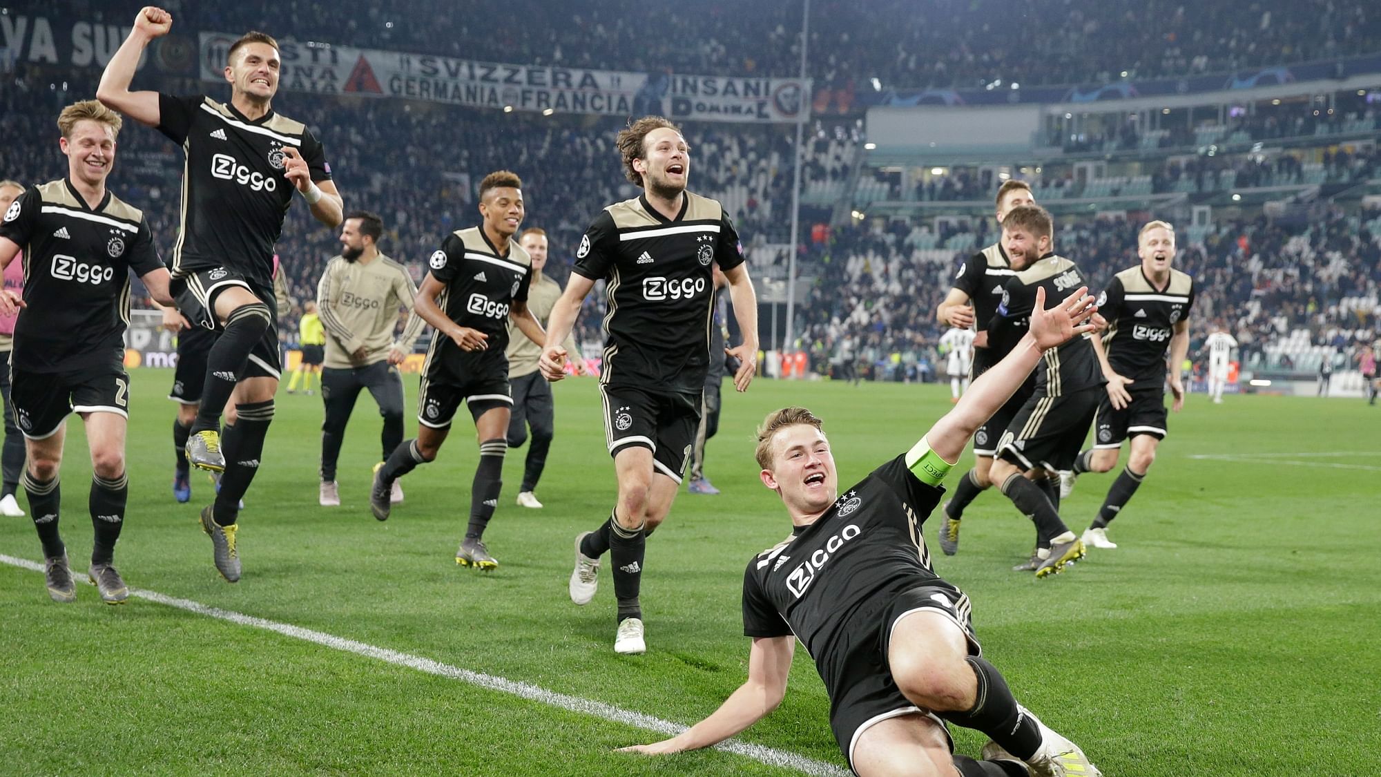 Ajax’s Matthijs de Ligt and teammates celebrate at the end of the Champions League, quarterfinal, second leg soccer match between Juventus and Ajax, at the Allianz stadium in Turin on Tuesday, 16 April.&nbsp;