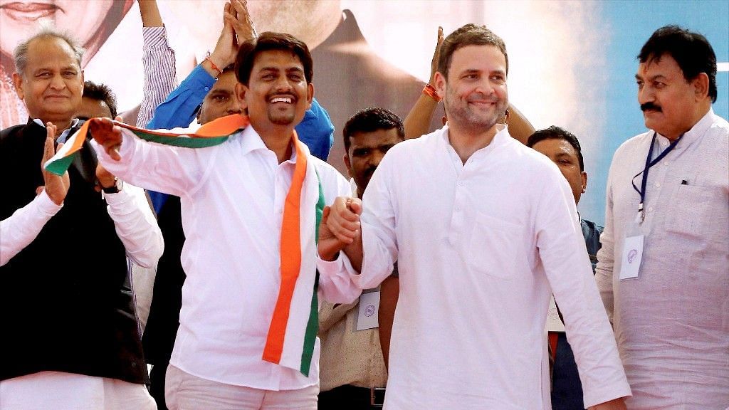 Congress vice-president Rahul Gandhi with OBC leader Alpesh Thakor, who joined the party, during a public meeting in Gandhinagar on 23 October, 2017.
