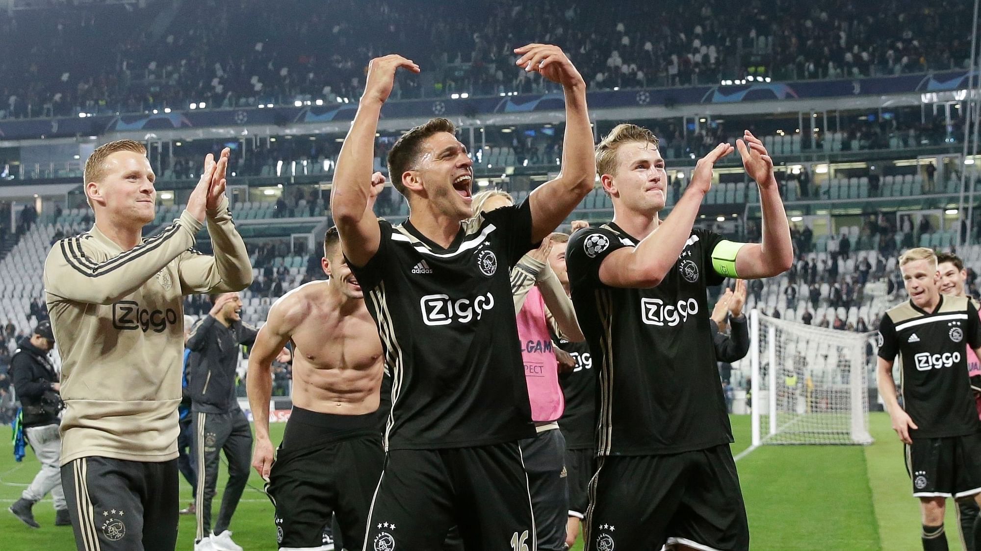Ajax’ players celebrate at the end of the Champions League, quarterfinal, second leg soccer match between Juventus and Ajax, at the Allianz stadium in Turin, Italy, Tuesday, April 16, 2019. Ajax won 2-1 and advances to the semifinal on a 3-2 aggregate.