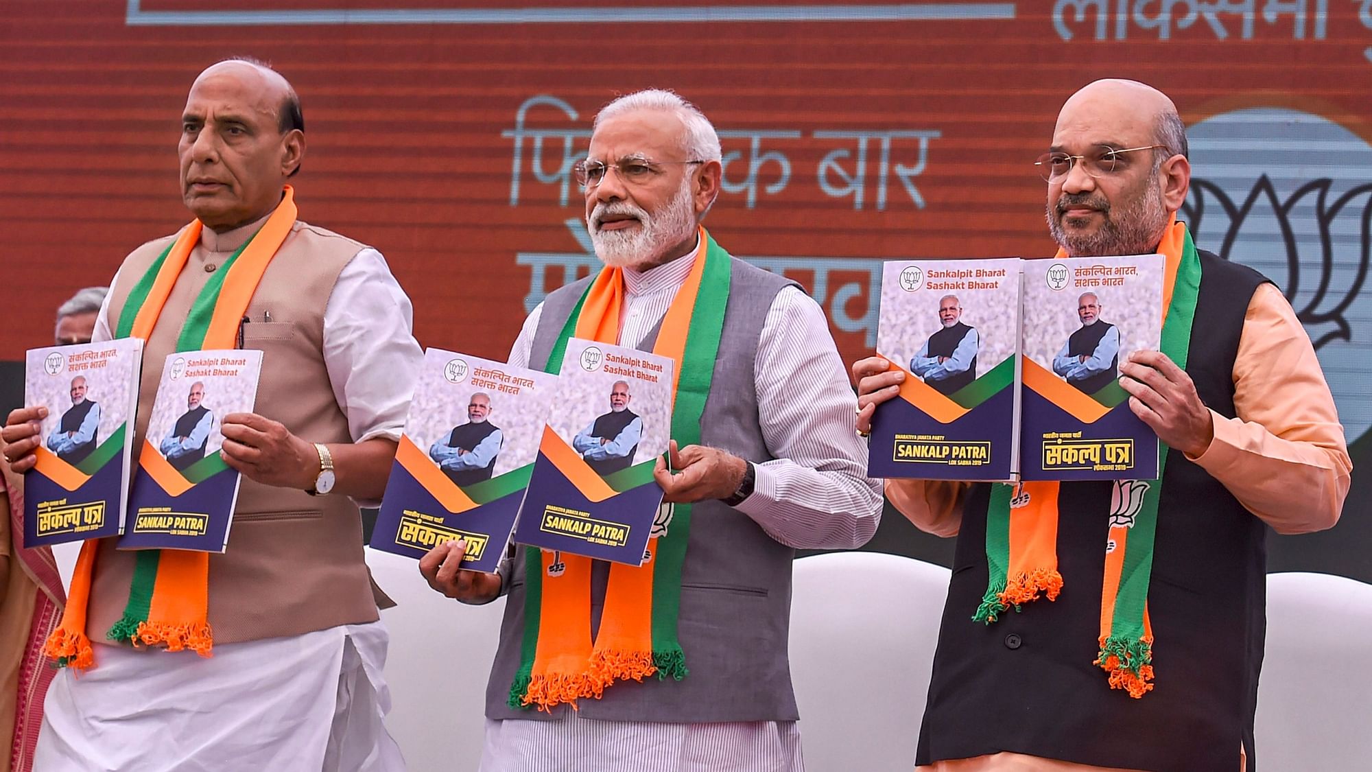 Prime Minister Narendra Modi, BJP President Amit Shah and Union Home Minister Rajnath Singh release Bharatiya Janata Party’s (BJP) manifesto <i>Sankalp Patra</i> for the Lok Sabha elections 2019.