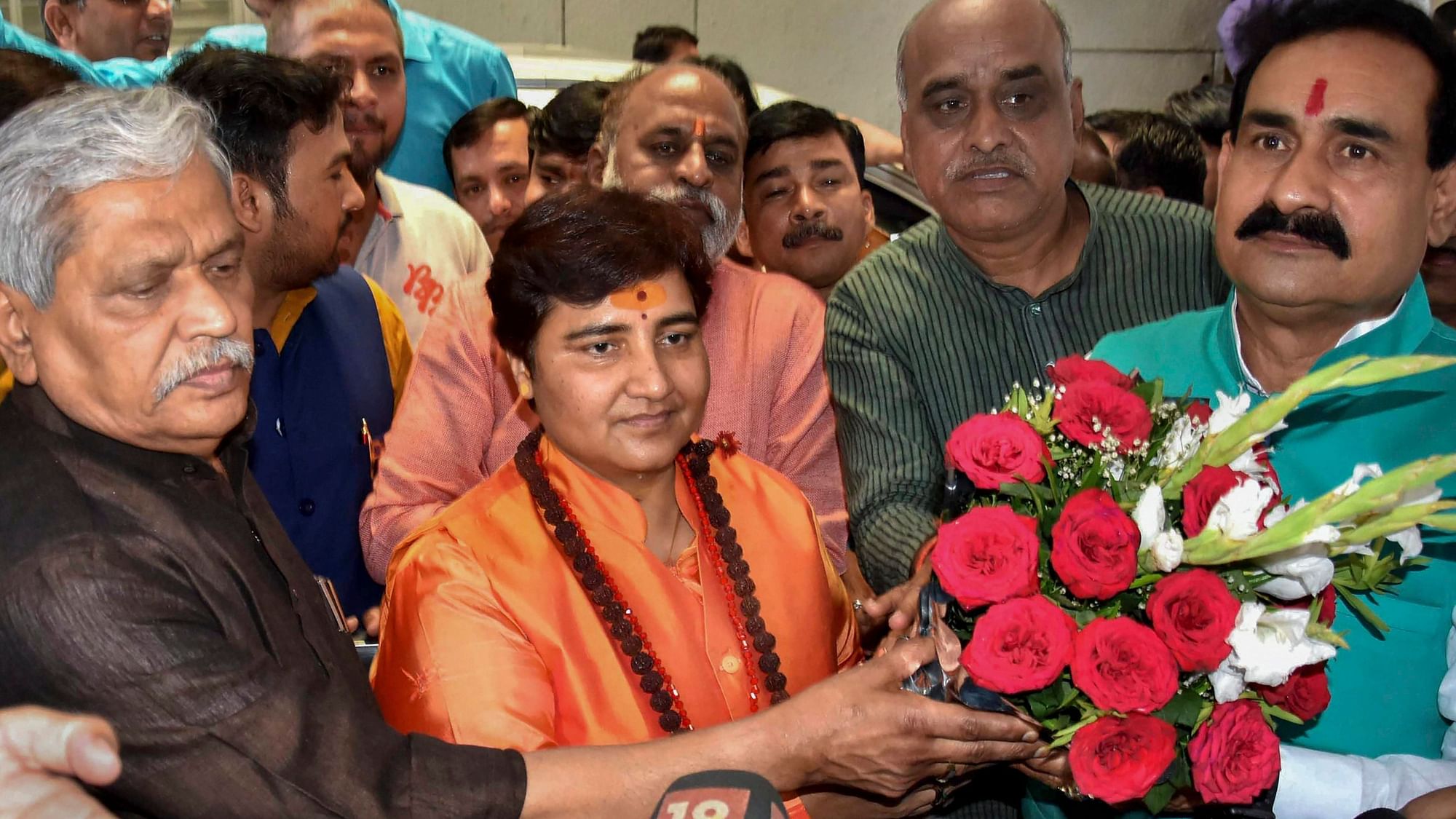 Sadhvi Pragya Singh Thakur is greeted by BJP National Vice President Prabhat Jha after her name was finalised as the party candidate for Bhopal constituency.