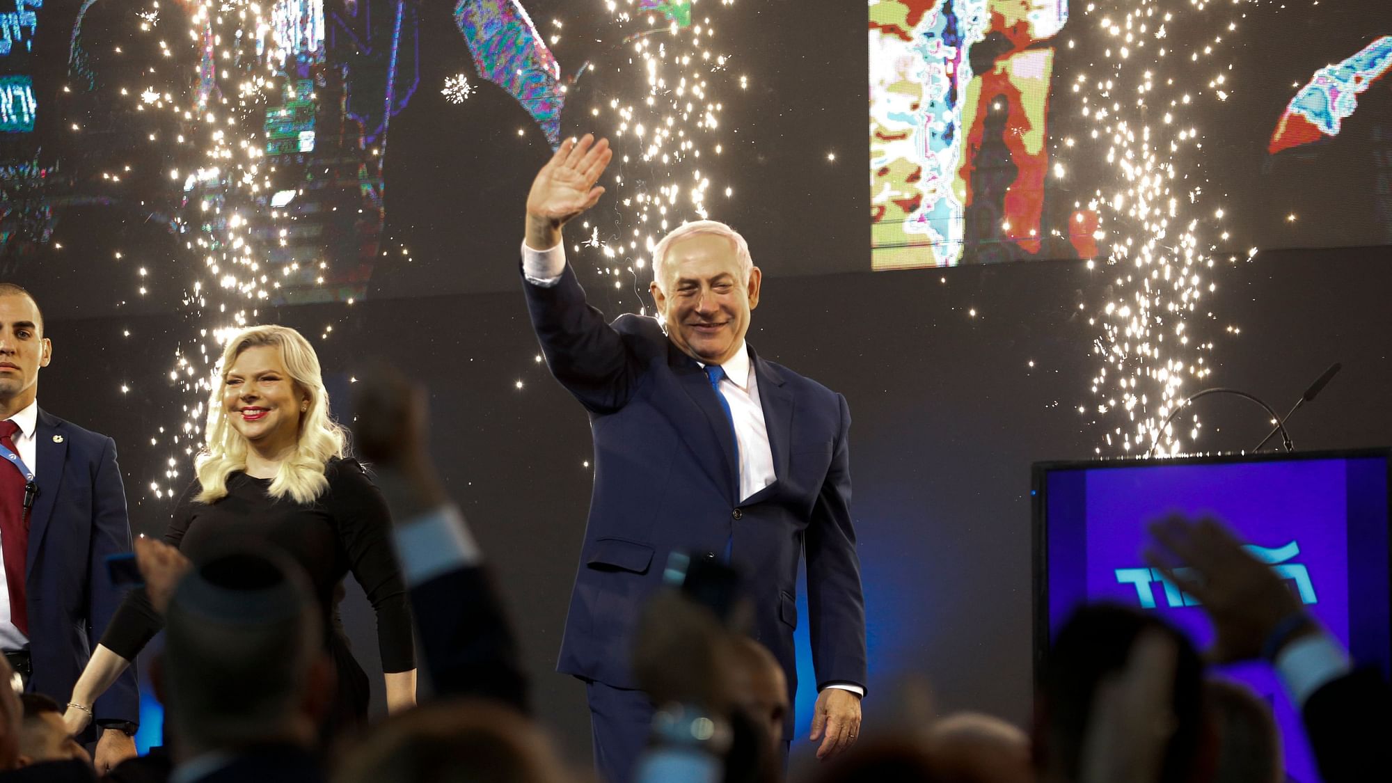 Israel’s Prime Minister Benjamin Netanyahu and Likud party leader and his wife Sara wave to his supporters after polls for Israel’s general elections closed in Tel Aviv.