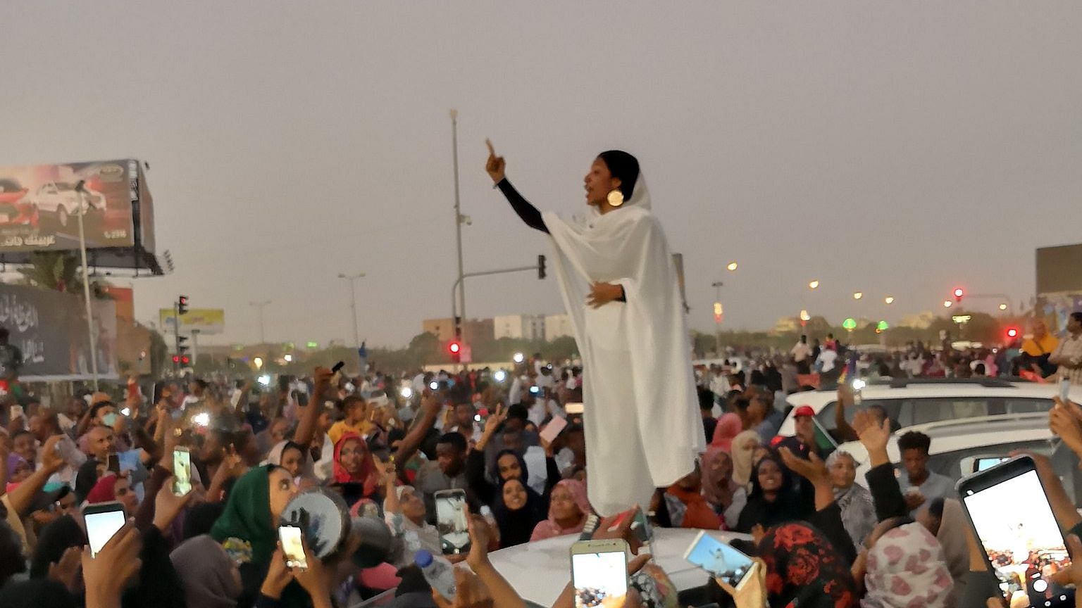 Alaa Salah amid a sea of protesters in Khartoum, Sudan’s capital city.