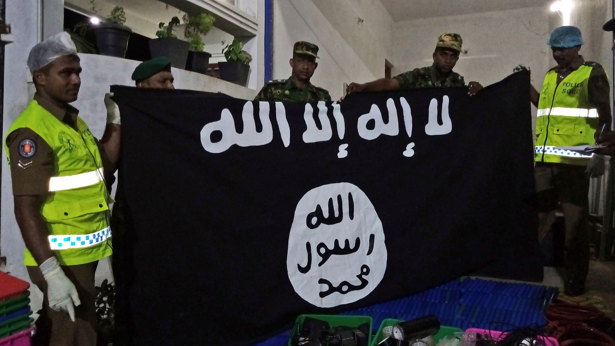 On 26 April 2019, Sri Lankan police officers show ISIS flag recovered from alleged hideout of militants, in Kalmunai, in Eastern Sri Lanka. Image used for representational purposes.