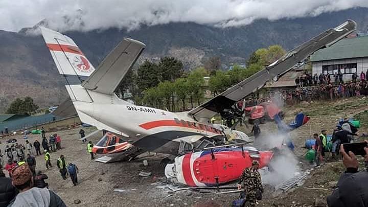 A small plane crashed into a parked helicopter during takeoff at the only airport in Nepal’s Everest region.