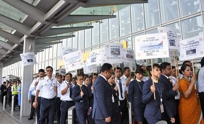 Kolkata: Employees of the debt-ridden Jet Airways stage a demonstration appealing the Central Government to save the airline, at Netaji Subhash Chandra Bose International Airport in Kolkata, on April 24, 2019. (Photo: Kuntal Chakrabarty/IANS)