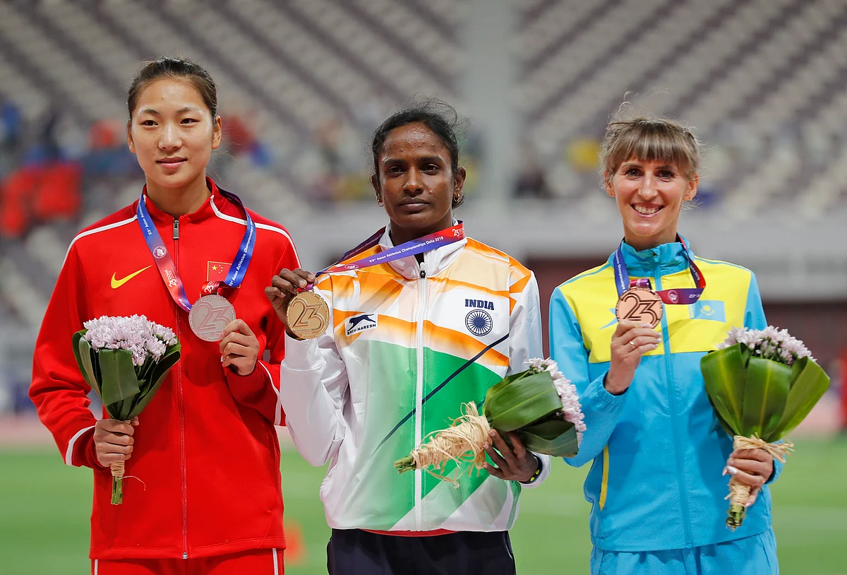 From left, China’s Wang Chunyu, India’s Gomathi Marimuthu, and Kazakhstan’s Margarita Mukasheva display their silver, gold and bronze medals respectively for the women’s 800-meters race at the Asian Athletics Championships in Doha