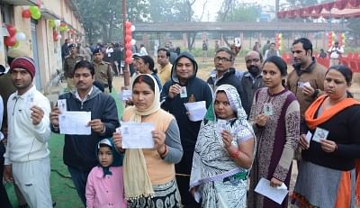 Lucknow: People queue up to cast their votes during the third phase of Uttar Pradesh Assembly polls in Lucknow on Feb 19, 2017. (Photo: IANS)