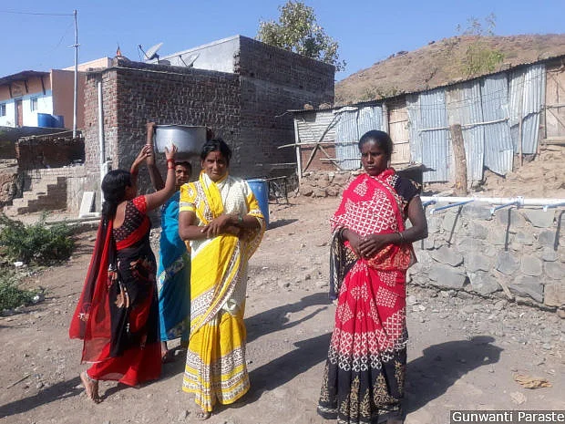 Forty-year-old Shindubai Upekar (in yellow) of Uttamnagar, a village near Dahiwandi, walks 5 km every day to collect drinking water. The taps seen in the background are connected to a community well constructed by the Dahiwandi gram panchayat.