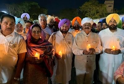 Amritsar: Punjab Governor V.P. Singh Badnore and Chief Minister Amarinder Singh participate in a candle light march organised to mark the centenary year of Jallianwala Bagh massacre in Amritsar, on April 12, 2019. (Photo: IANS)