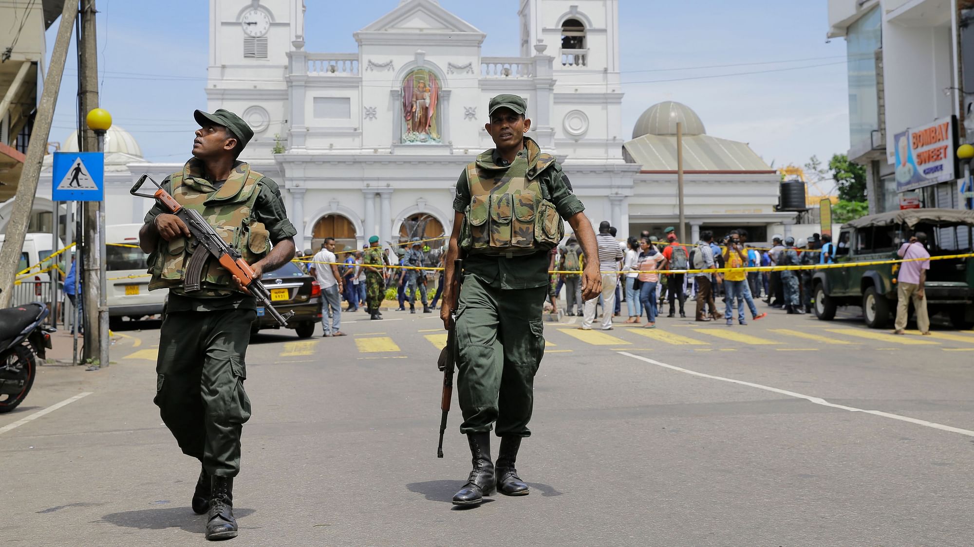 Sri Lankan soldiers secure the area around St. Anthony’s Shrine after a blast in Colombo.
