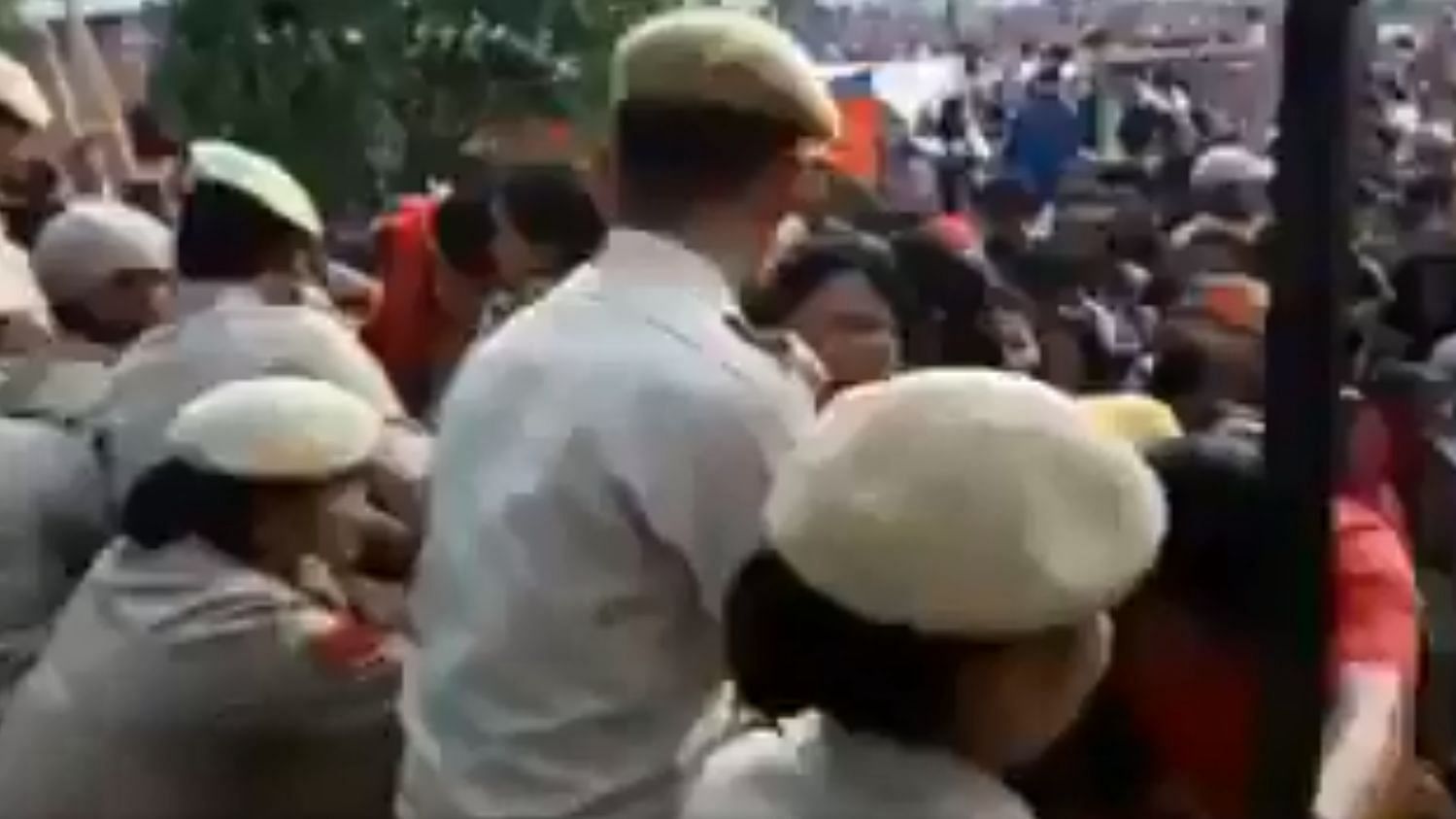 In the video, people are seen rushing out of the rally venue and the police are trying to control the crowd.