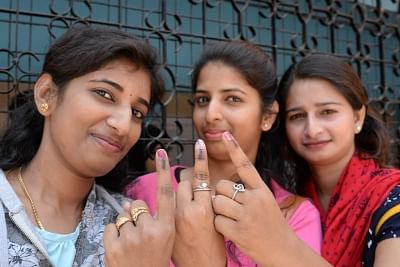 Bengaluru: Women show their fingers marked with phosphoric ink after casting votes for the second phase of 2019 Lok Sabha elections, in Bengaluru on April 18, 2019. (Photo: IANS)