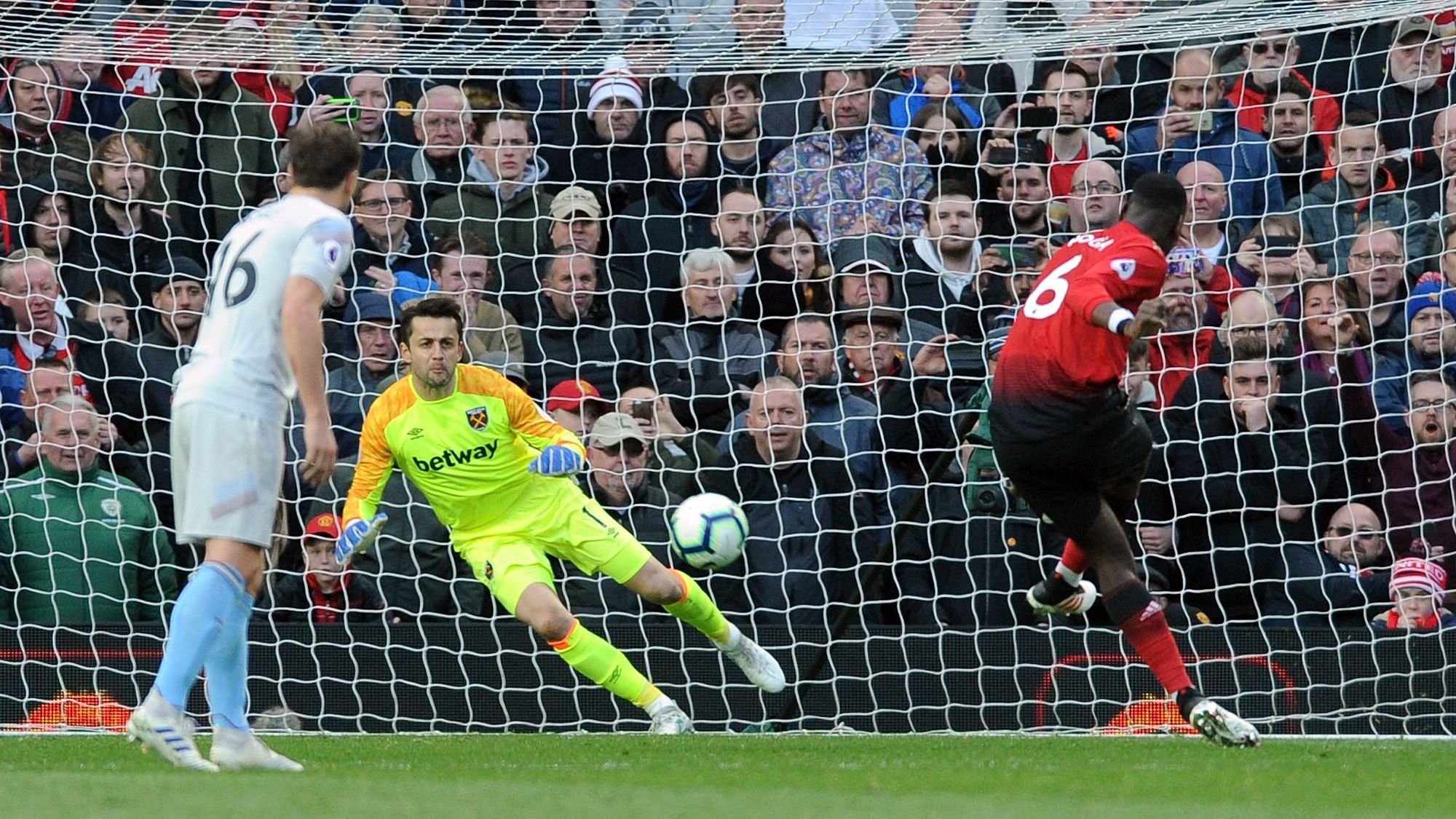 Manchester United’s Paul Pogba scores his side’s second goal from the penalty spot past West Ham goalkeeper Lukasz Fabianski.