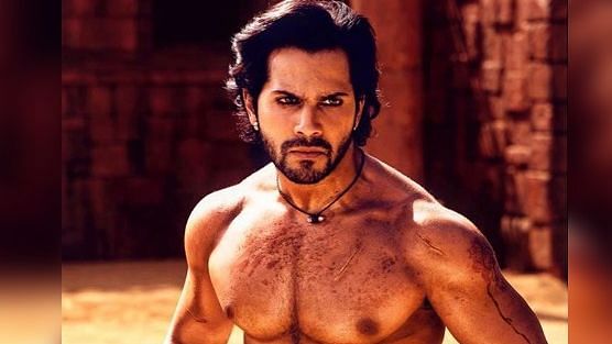 Varun Dhawan shows off his abs in a scene from <i>Kalank</i>.&nbsp;