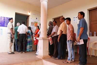 Verem, North Goa: People stand in a queue to caste their vote for Lok Sabha elections at a polling booth in Verem, North Goa on April 23, 2019. (Photo: IANS)