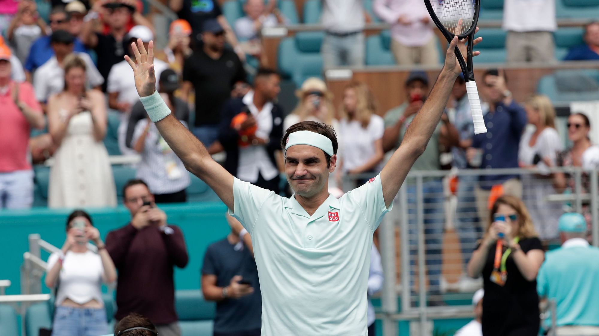 Roger Federer reacts after defeating John Isner in the singles final of the Miami Open.
