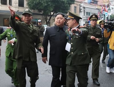 Hanoi: Police officers haul away an unidentified man impersonating North Korean leader Kim Jong-un near the venue for a two-day U.S.-North Korean summit in Hanoi on Feb. 27, 2019.(Yonhap/IANS)