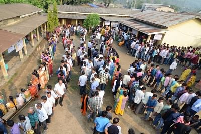 Guwahati: People wait in queue to cast vote during the third phase of Lok Sabha polls, in Guwahati, on April 23, 2019. (Photo: IANS)