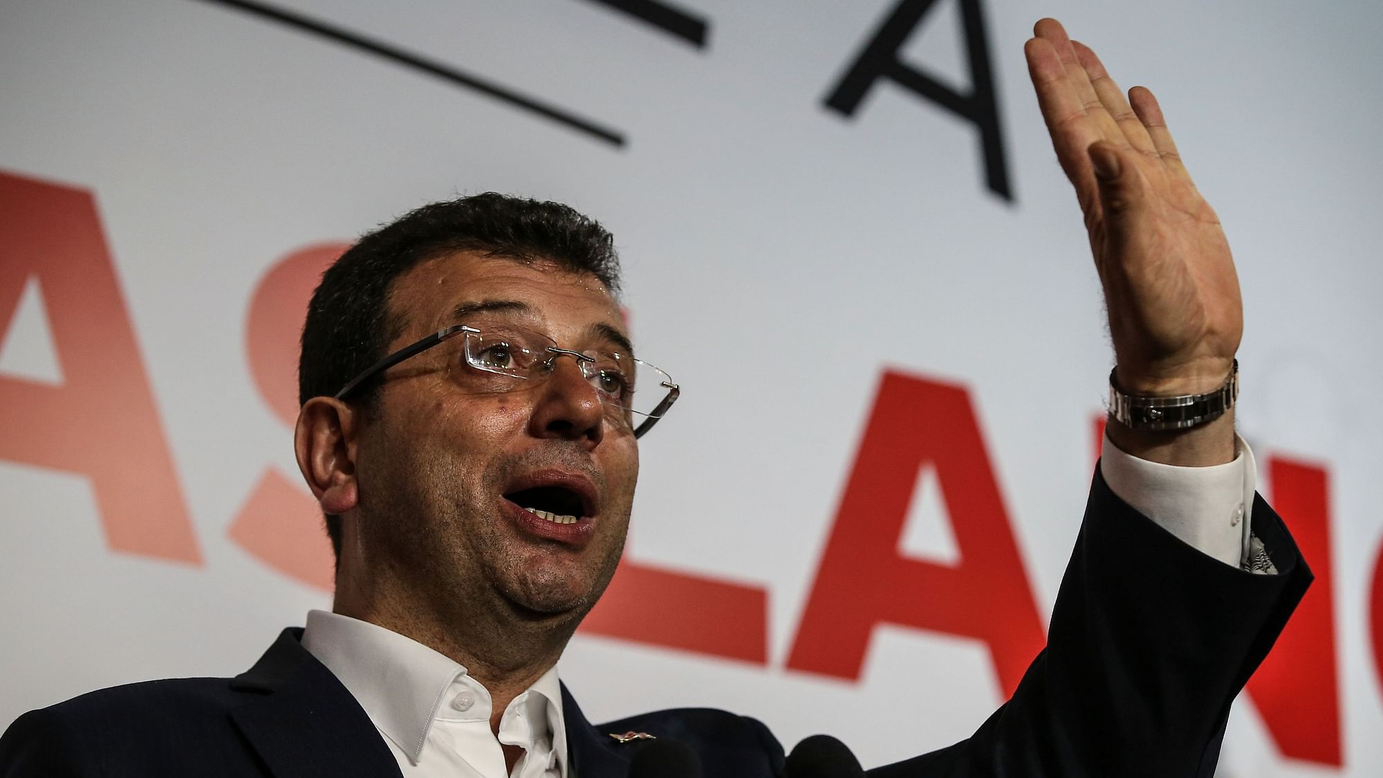 Ekrem Imamoglu, the candidate from an alliance led by the secular Republican People’s Party, (CHP) gestures as he declares victory during a news conference.&nbsp;