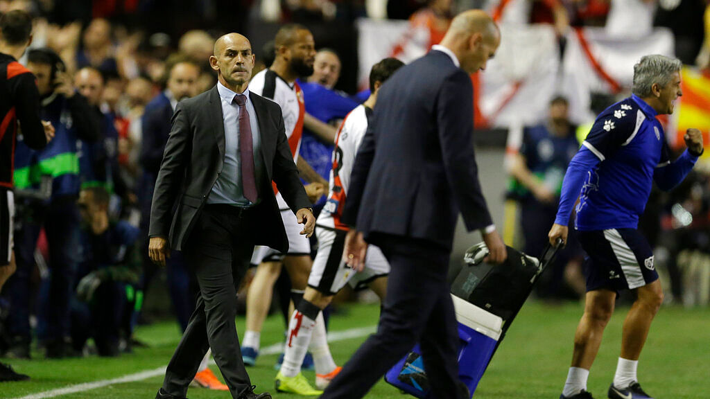 Rayo Vallecano’s coach Paco Jemez, left, looks over to Real Madrid’s coach Zinedine Zidane as he walks off the pitch at the end of a Spanish La Liga soccer match between Rayo Vallecano and Real Madrid.