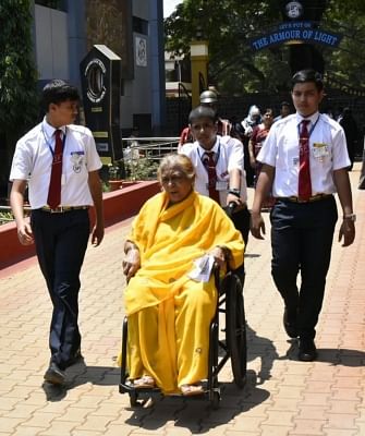 Belgaum: An old voter being escorted to a polling station to cast her vote for the third phase of 2019 Lok Sabha elections in Karnataka