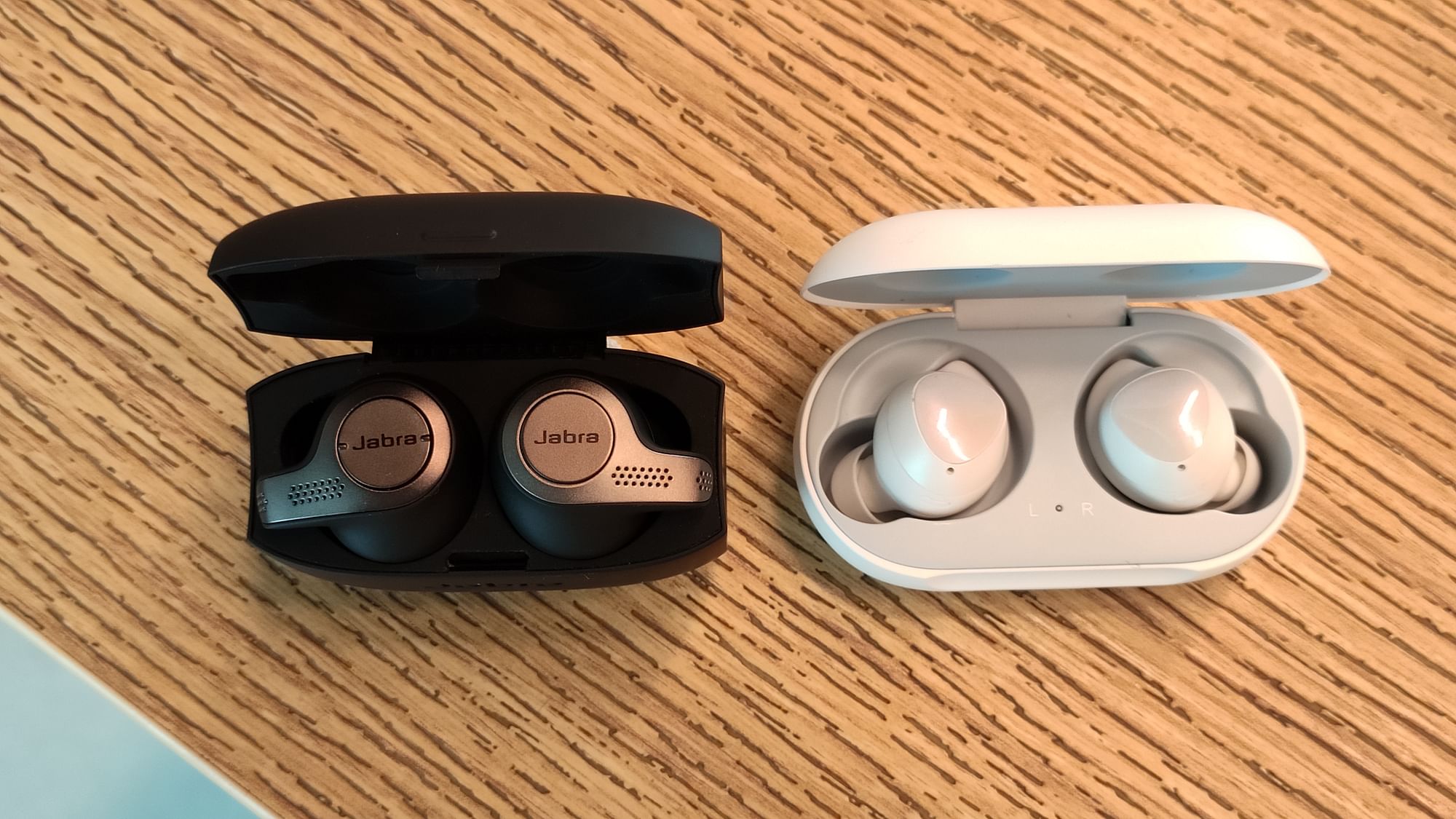 The Jabra Evolve 65t (left) and the Samsung galaxy Buds (right).