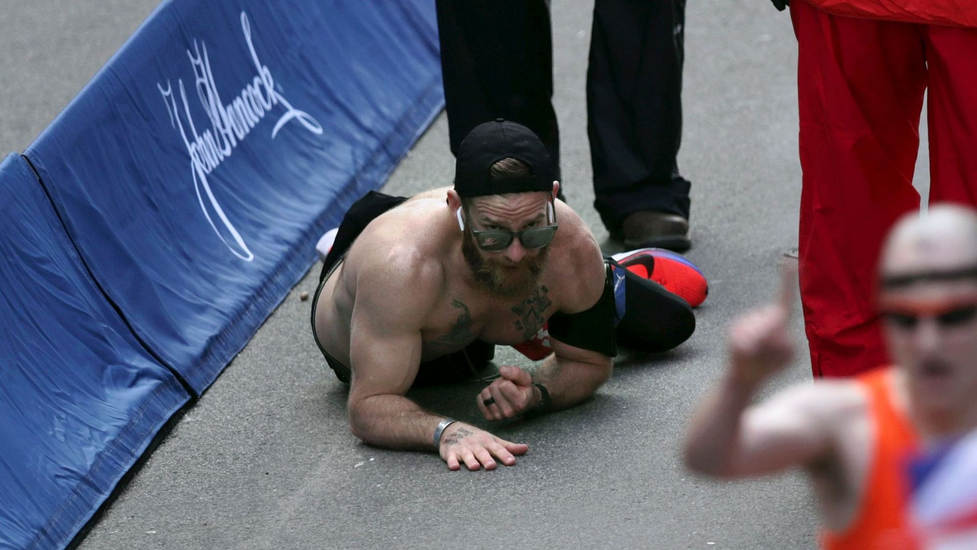 Micah Herndon, of Tallmadge, Ohio, crawls to the finish line in the 123rd Boston Marathon on Monday, April 15, 2019, in Boston.&nbsp;
