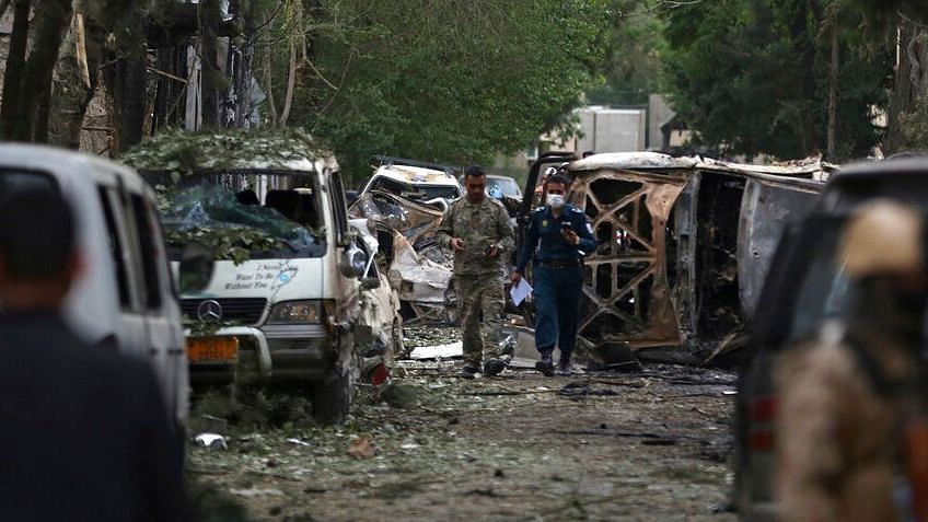 Afghan security forces guard the site of the explosion in Kabul, Afghanistan.
