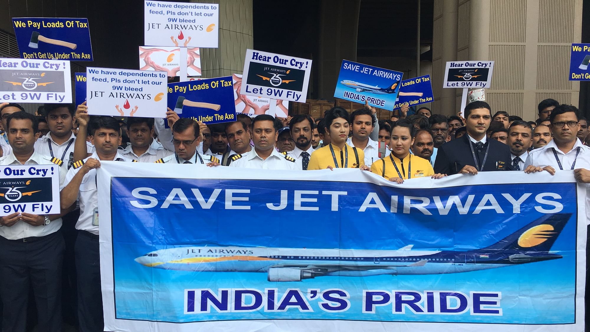 Jet Airways employees hold a silent protest outside Mumbai’s Chhatrapati Shivaji International Airport.&nbsp;