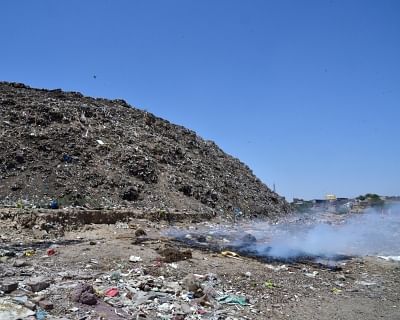 A view of garbage seen burning at a dumping ground in Panaji. (Photo: IANS)