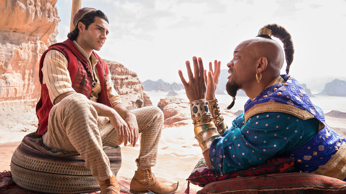 Will Smith and Mena Massoud in <i>Aladdin.</i>