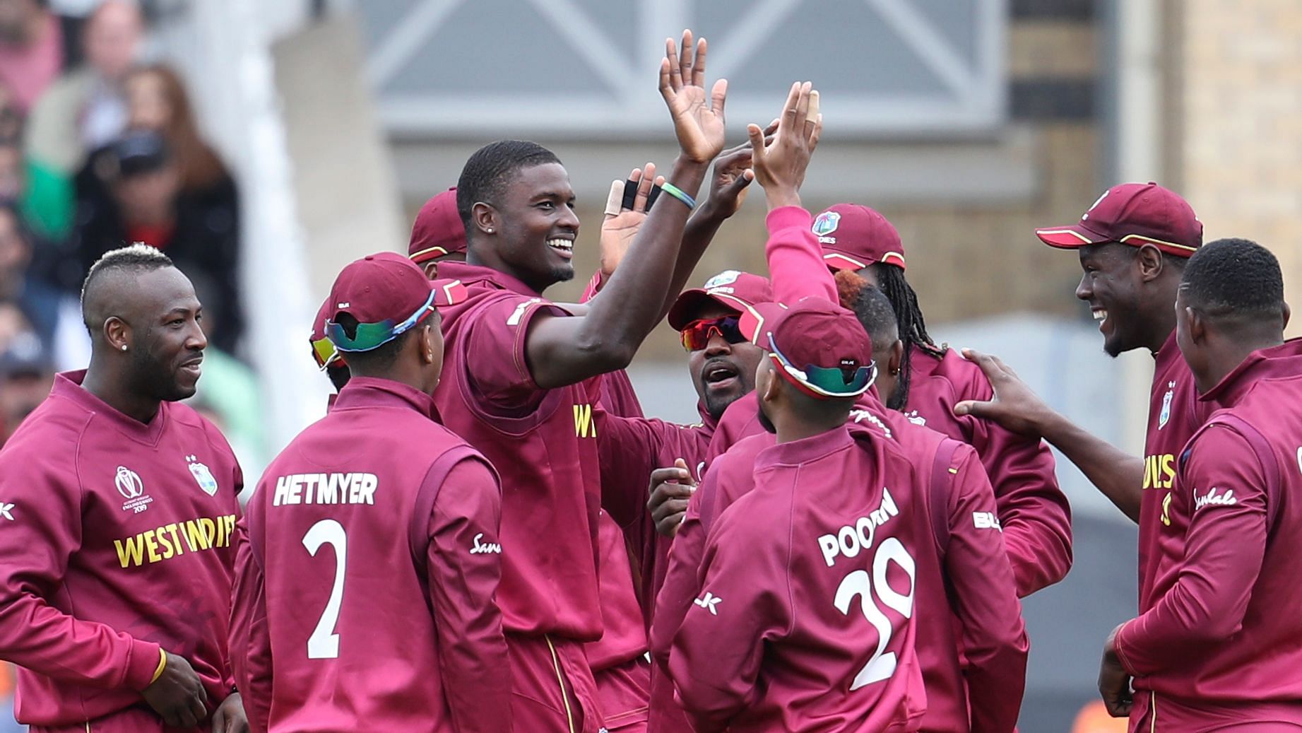 West Indies cricketers celebrate a wicket during their World Cup match against Pakistan.