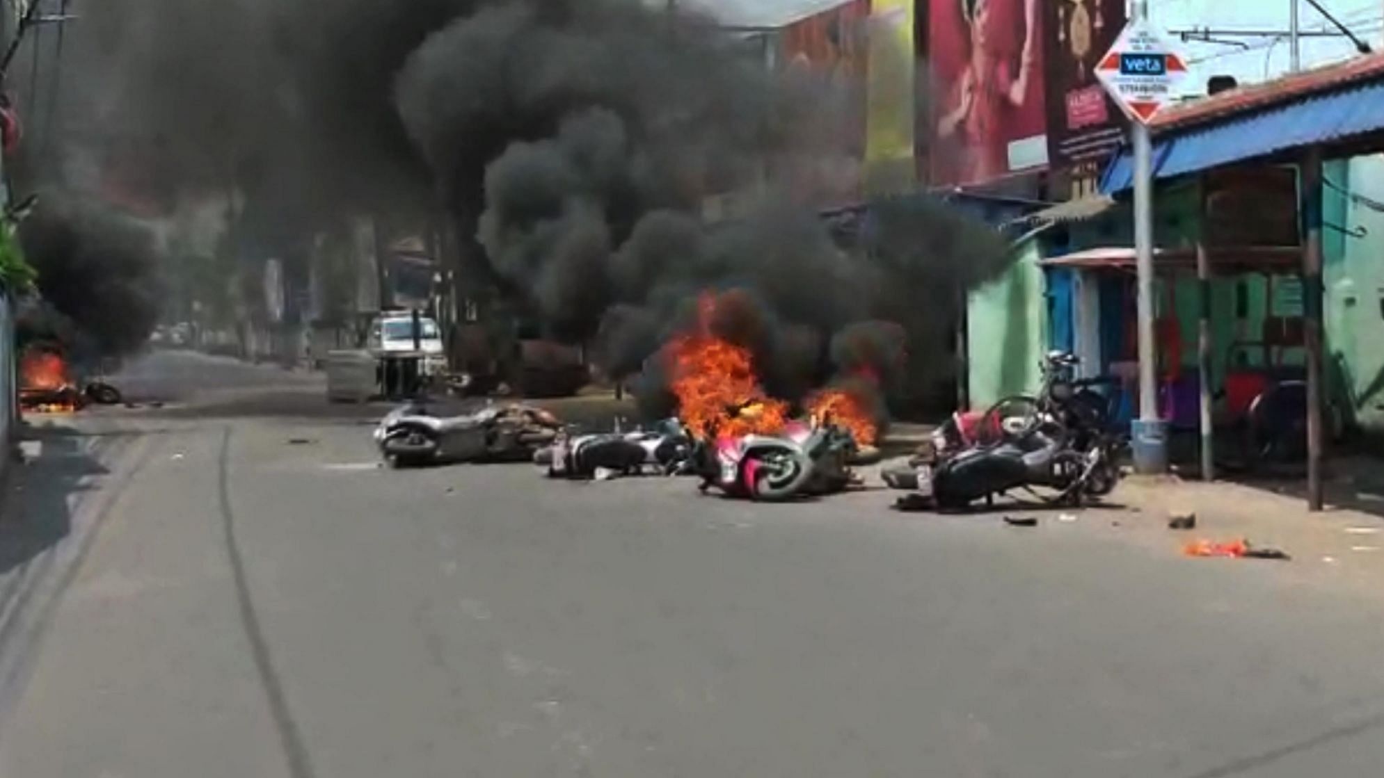Caption: Barrackpore: A view of vehicles set on fire by an irate mob after violence broke out between TMC and BJP workers, after counting for the votes cast in the 2019 Lok Sabha polls concluded, in West Bengal’s Barrackpore, on 24 May  2019.&nbsp;