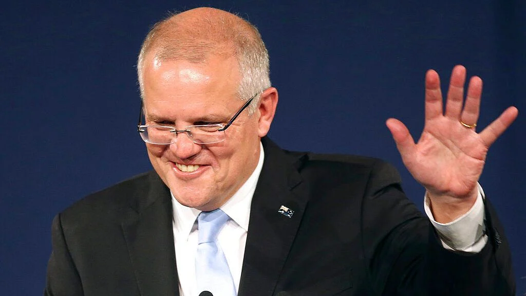 Australian Prime Minister Scott Morrison speaks to party supporters after his opponent concedes defeat in the federal election in Sydney. 
