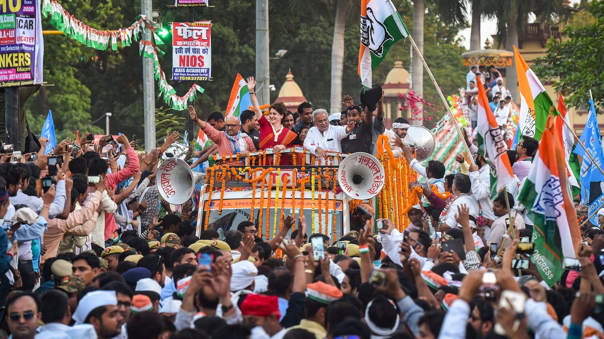 Congress General Secretary Priyanka Gandhi Vadra  waves at  supporters during a roadshow  in Varanasi. &nbsp;
