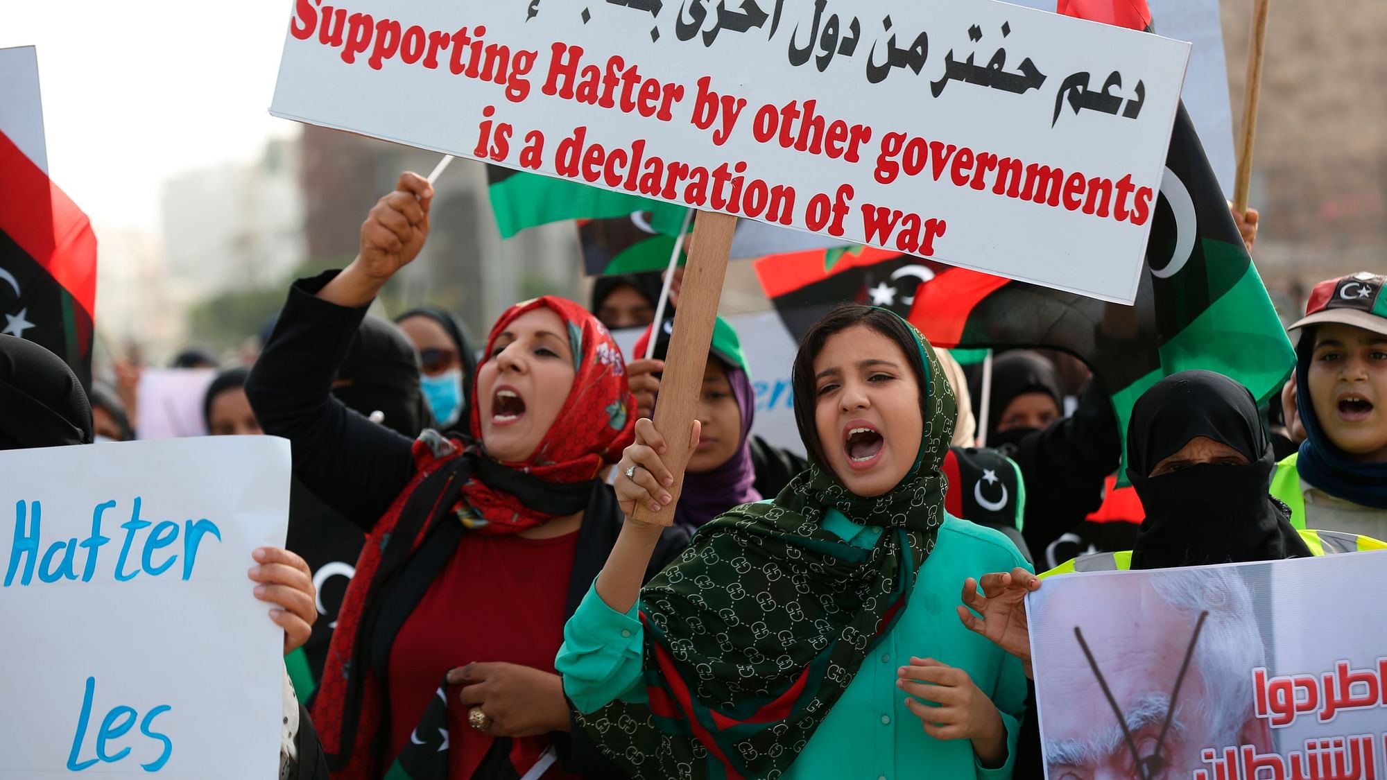 Protesters march chant slogans against military operations by Field Marshal Khalifa Hifter’s forces in Martyrs’ Square on in Tripoli, Libya on Friday, April 26, 2019.