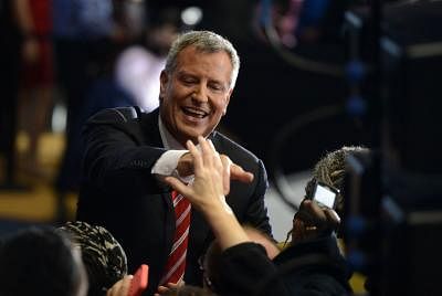 NEW YORK, Nov. 6, 2013 (Xinhua/IANS) -- Newly elected New York City Mayor Bill de Blasio greets his supporters at his election night party in New York City, the United States, Nov. 5, 2013. New York City mayoral hopeful Bill de Blasio, a liberal Democrat who campaigned as the city