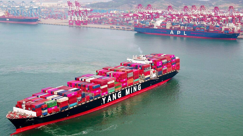 A container ship sails off the dockyard in Qingdao in eastern China’s Shandong province on Wednesday.