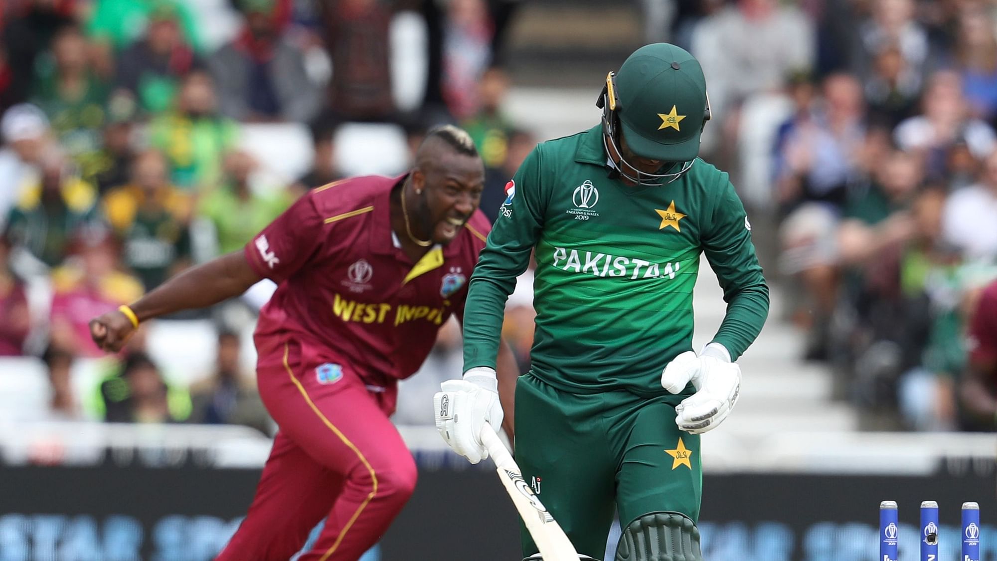 Pakistan’s Shadab Khan walks off the field, bowled by West Indies’ Andre Russell, during their Cricket World Cup match at Trent Bridge cricket ground in Nottingham, England, Friday, May 31, 2019.