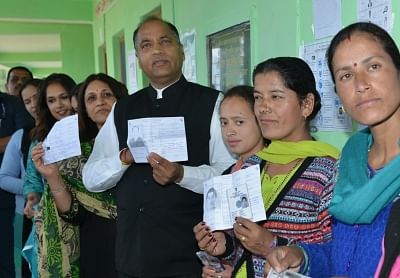 Mandi: Himachal Pradesh Chief Minister Jairam Thakur waits for his turn to cast vote at a polling centre in Mandi on May 19, 2019. (Photo: IANS)
