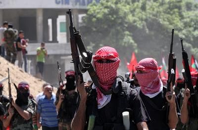 GAZA, Sept. 2, 2014 (Xinhua) -- Palestinian militants from the Popular Front for the Liberation of Palestine (PFLP) take part in a military parade one week after the Egypt-mediated ceasefire between Israel and Hamas in Gaza city, on Sept. 2, 2014. (Xinhua/Yasser Qudih/IANS)