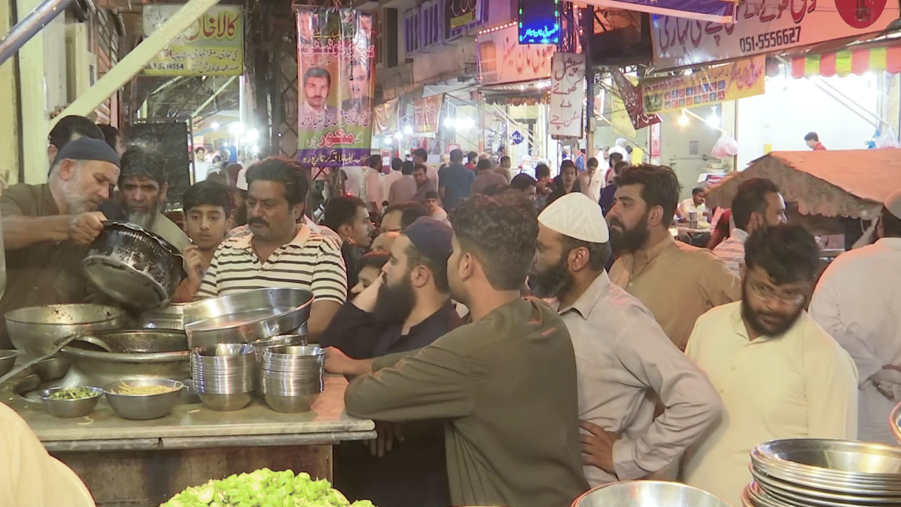 After midnight, street vendors open shop in Rawalpindi, selling a selection of food during the holy month of Ramzan.