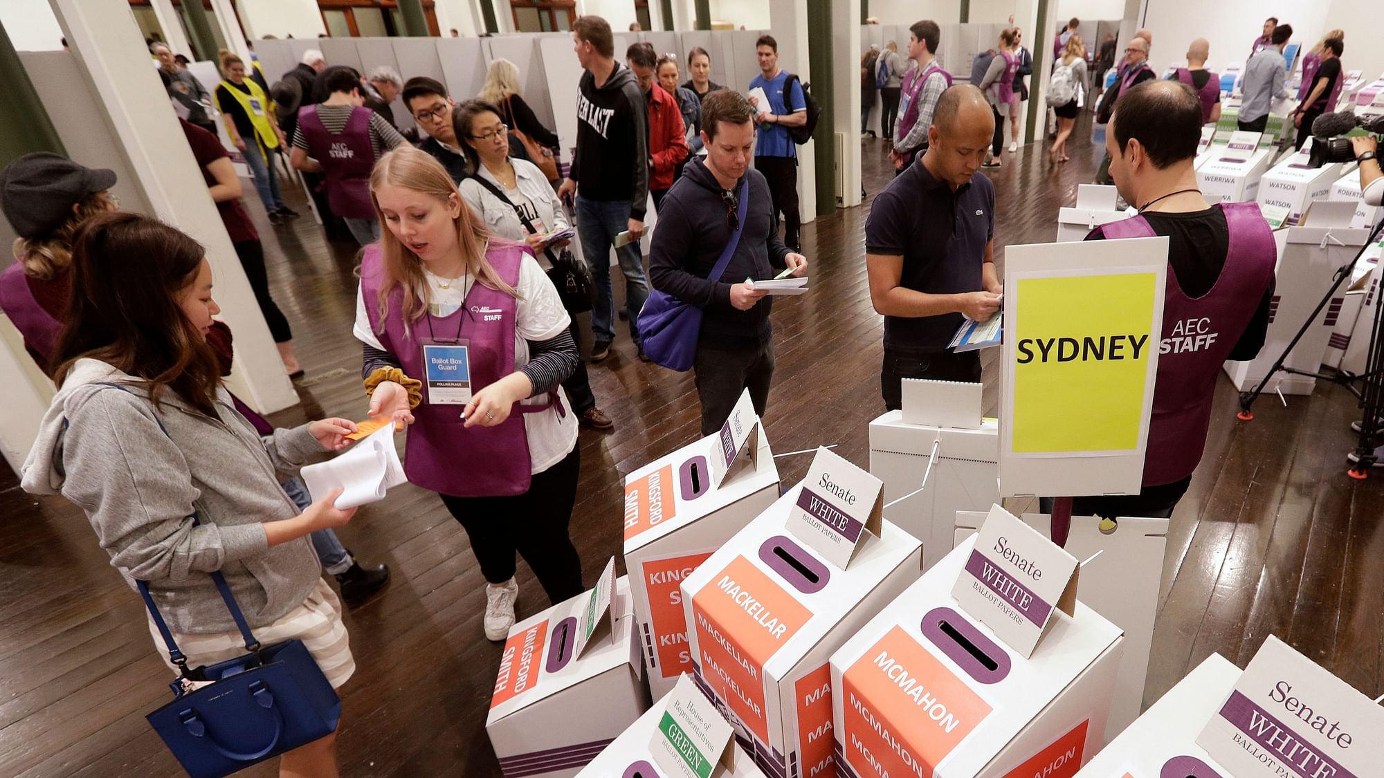 Voters cast their ballots at the Town Hall in Sydney, Australia