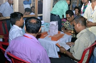 Officials busy counting postal ballots inside a counting room. (File Photo: IANS)