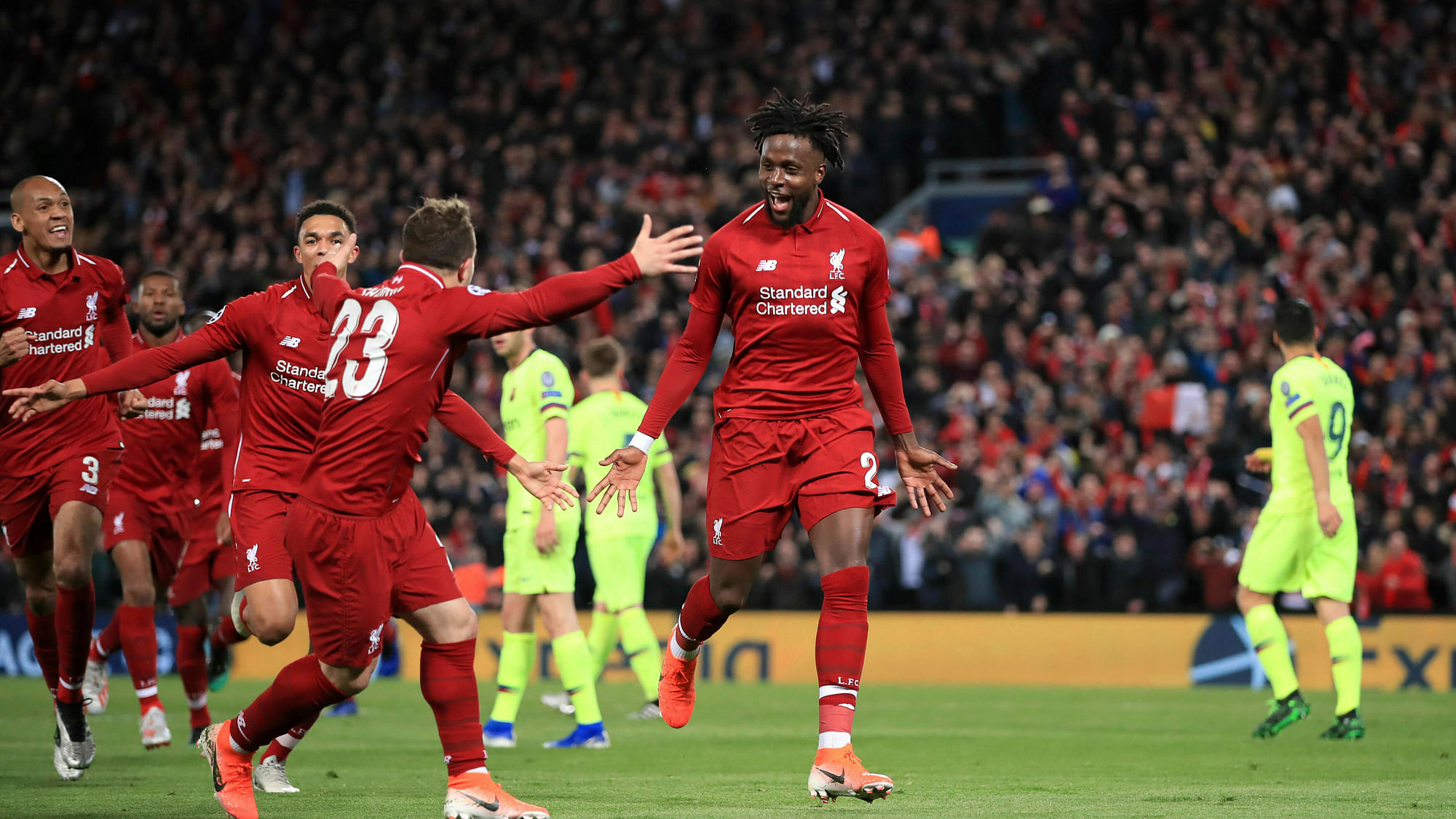 Liverpool’s Divock Origi, center, celebrates scoring his side’s fourth goal of the game during the Champions League Semi Final, second leg soccer match between Liverpool and Barcelona at Anfield, Liverpool.&nbsp;